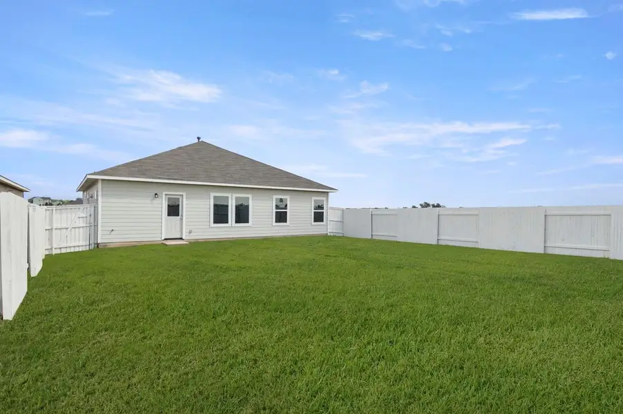 Exterior details and patio area of a home in Casetta Ranch, Kyle (Image 4).