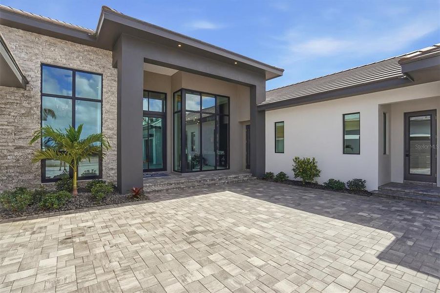 Exterior details and patio area of a home in , Sarasota (Image 24).