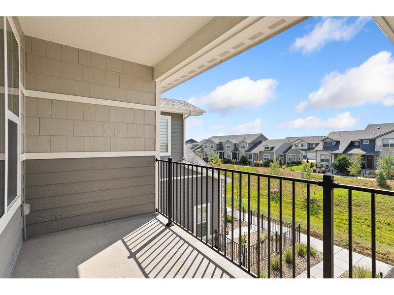 Exterior details and patio area of a home in The Lakes at Centerra, Loveland (Image 3).