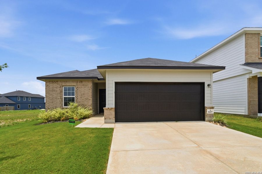 Front exterior of a new home in Morgan Meadows, San Antonio, TX, highlighting curb appeal (Image 12). Front exterior of a new home in Morgan Meadows, San Antonio, TX, highlighting curb appeal (Image 12).