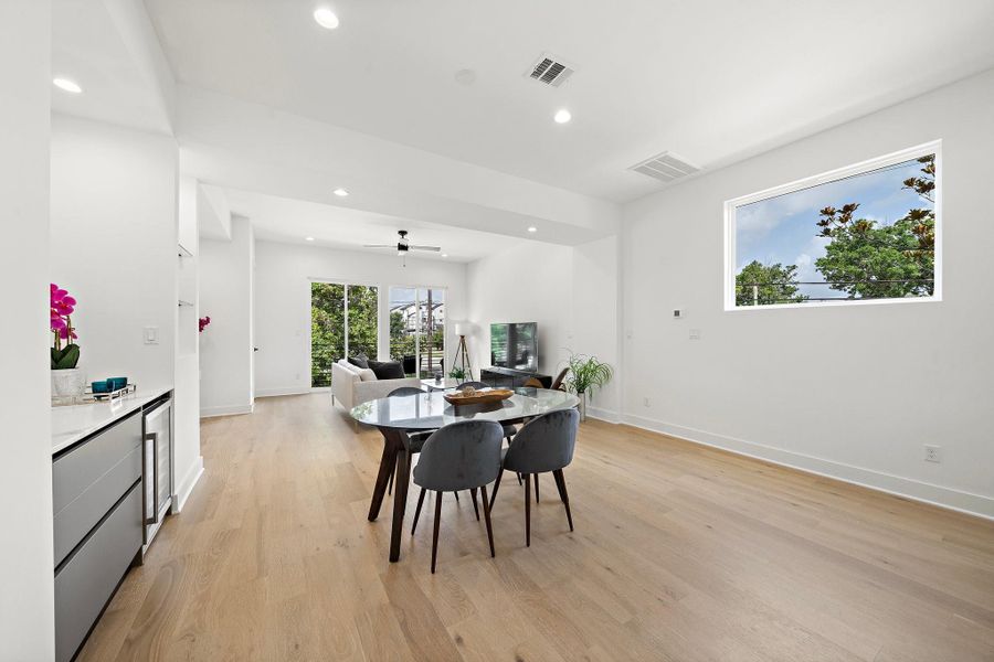 A bright and modern open-concept design enhanced by the warmth and elegance of European white oak engineering wood floors.