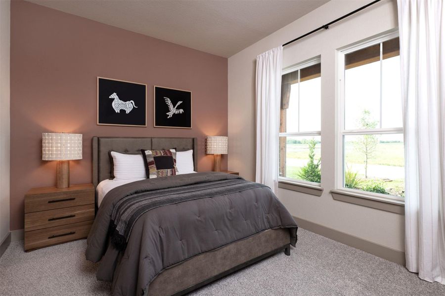 Your secondary bedroom features plush carpet, fresh paint, closet, and a large window that lets in plenty of natural lighting.