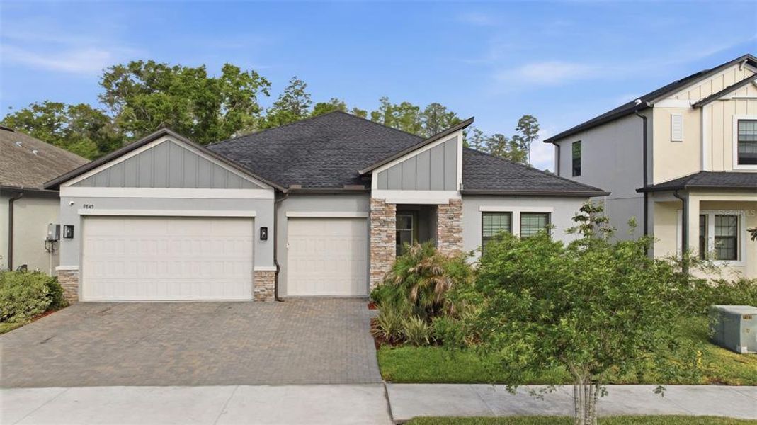 Front exterior of a new home in , Land O' Lakes, FL, highlighting curb appeal (Image 26).