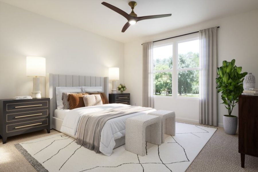 A bedroom with a bed and a fan.