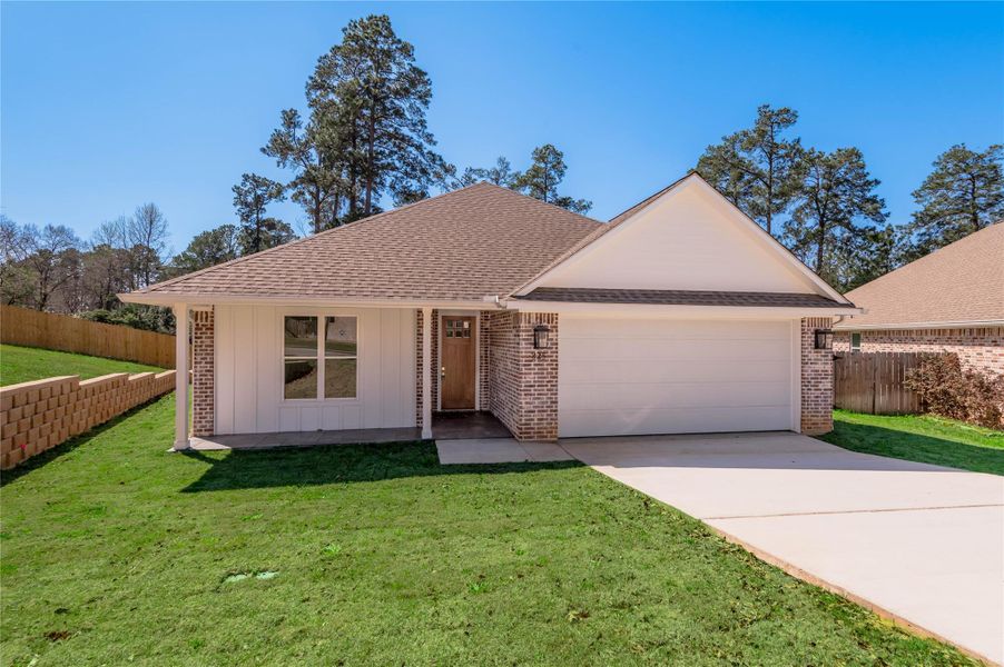 Front exterior of a new home in , Nacogdoches, TX, highlighting curb appeal (Image 20).