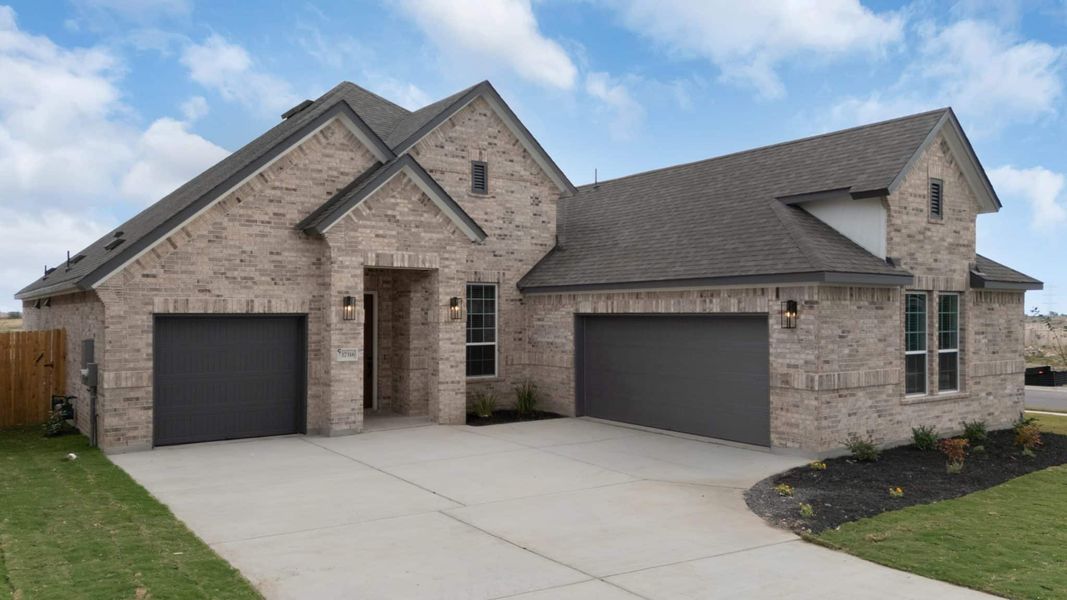 Front exterior of a new home in The Grove at Blackhawk, Pflugerville, TX, highlighting curb appeal (Image 26).