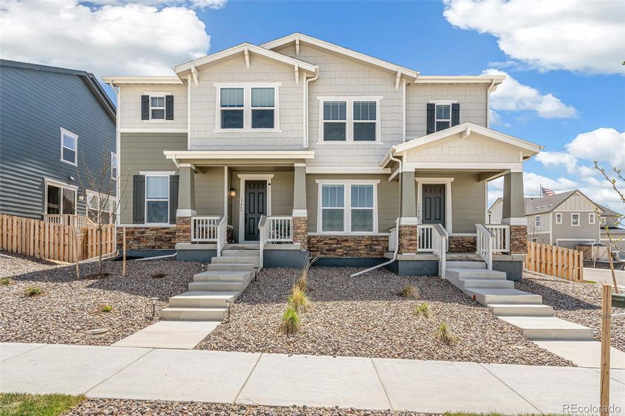 Front exterior of a new home in Turnberry, Commerce City, CO, highlighting curb appeal (Image 20). Front exterior of a new home in Turnberry, Commerce City, CO, highlighting curb appeal (Image 20).
