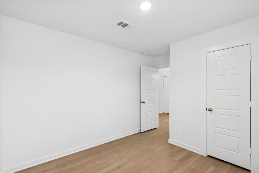 Spacious, unfurnished interior of a new home in Pinewood at Grand Texas, New Caney (Image 21).