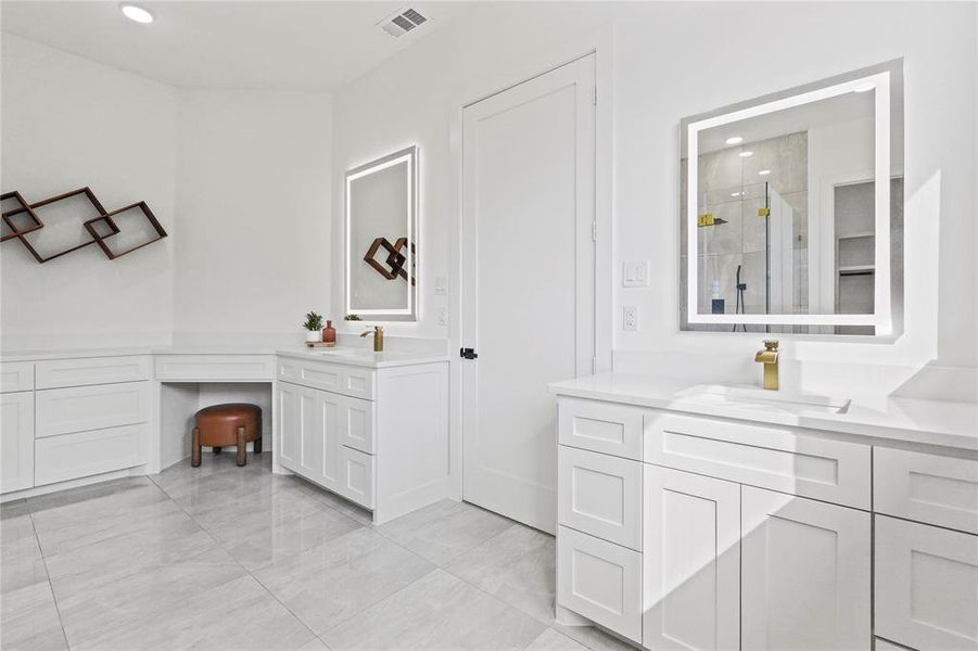 Full bathroom with a stall shower, two vanities, and recessed lighting Full bathroom with a stall shower, two vanities, and recessed lighting