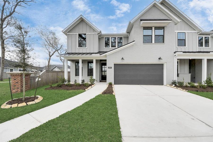 Front exterior of a new home in Sienna: Signature Series, Missouri City, TX, highlighting curb appeal (Image 24). Front exterior of a new home in Sienna: Signature Series, Missouri City, TX, highlighting curb appeal (Image 24).