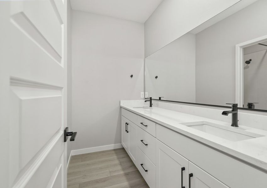 This bathroom has dual-vanity sinks.