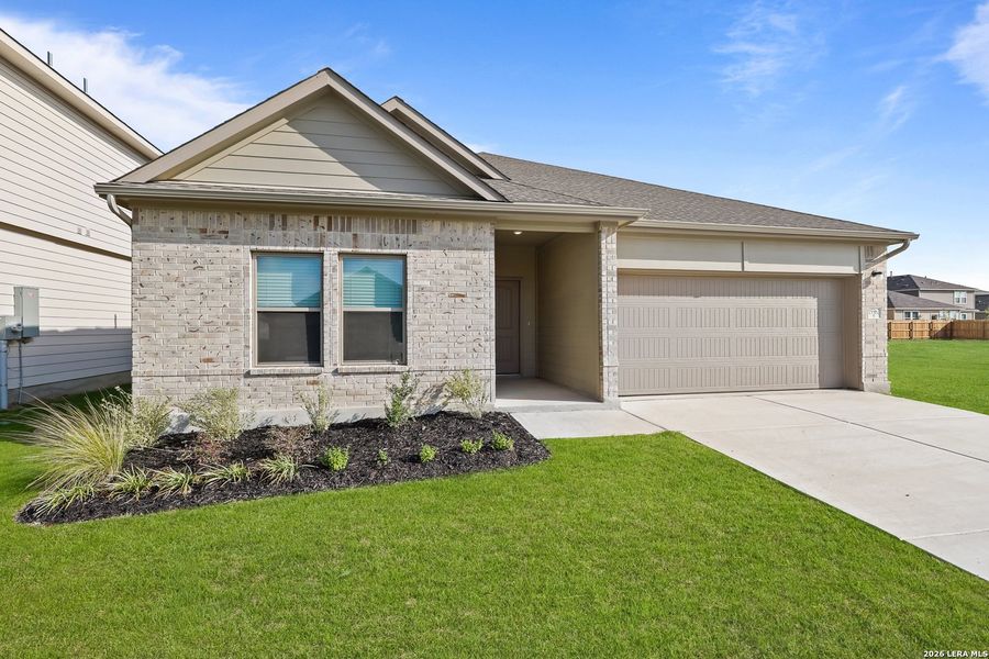 Front exterior of a new home in Summerlin, Castroville, TX, highlighting curb appeal (Image 2). Front exterior of a new home in Summerlin, Castroville, TX, highlighting curb appeal (Image 2).