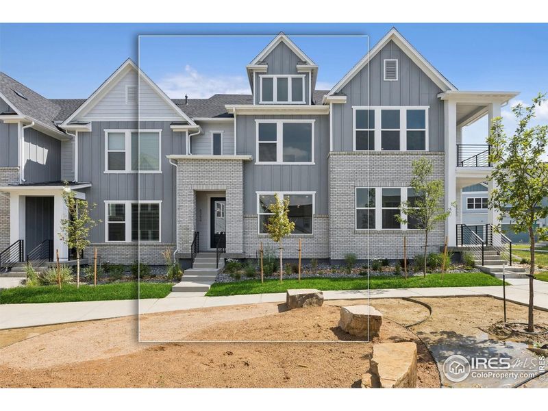 Front exterior of a new home in Kinston Mainstreet Townhomes, Loveland, CO, highlighting curb appeal (Image 26). Front exterior of a new home in Kinston Mainstreet Townhomes, Loveland, CO, highlighting curb appeal (Image 26).