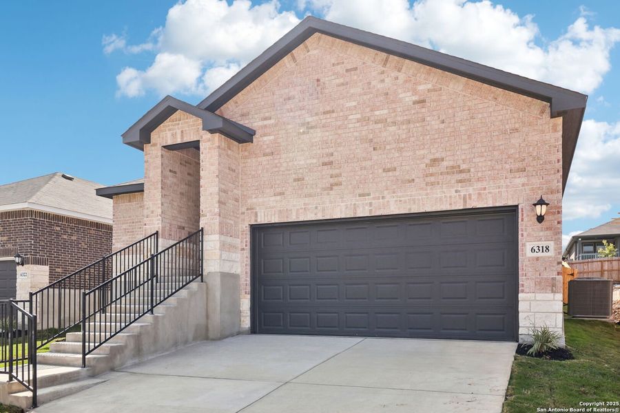 Front exterior of a new home in Comanche Ridge, San Antonio, TX, highlighting curb appeal (Image 32).