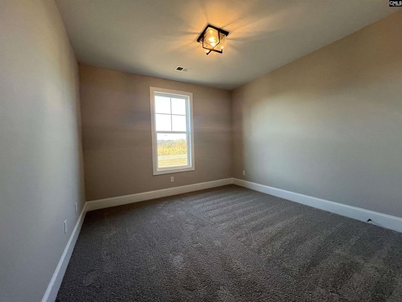 Spacious, unfurnished interior of a new home in The Cove, Sumter (Image 18).