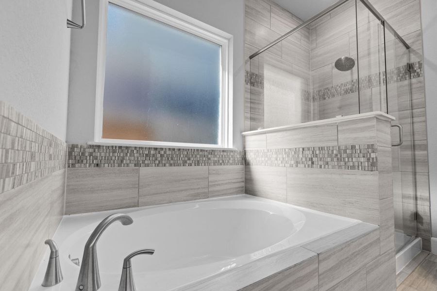 Primary bath, tub and shower.