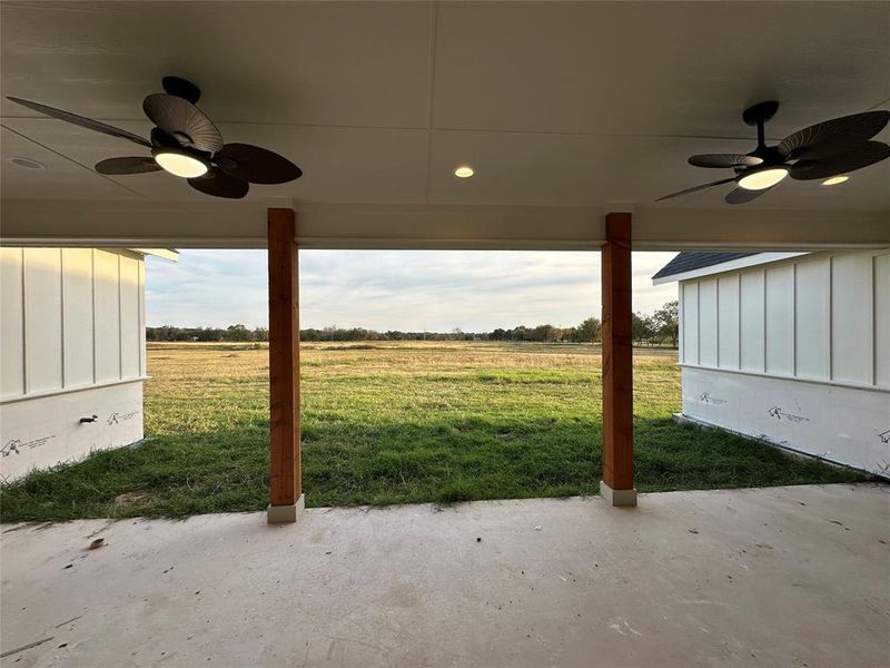 View of patio / terrace featuring a rural view and ceiling fan