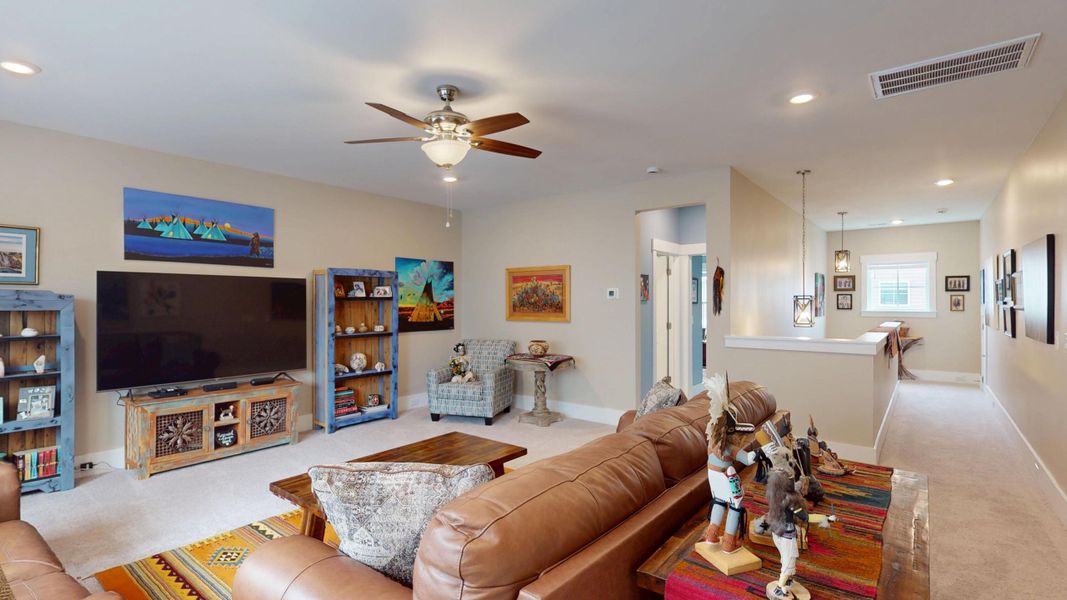 Furnished interior view inside a new home in Summerwind Crossing at Lakes of Cane Bay, Summerville (Image 58).
