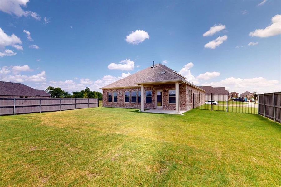 Exterior details and patio area of a home in Prairie Ridge at Goodland, Venus (Image 3). Exterior details and patio area of a home in Prairie Ridge at Goodland, Venus (Image 3).