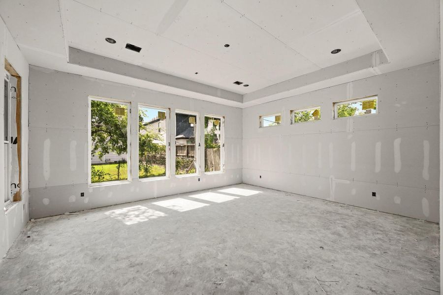 The ground floor master suite features a tray ceiling and tons of natural light! The ground floor master suite features a tray ceiling and tons of natural light!
