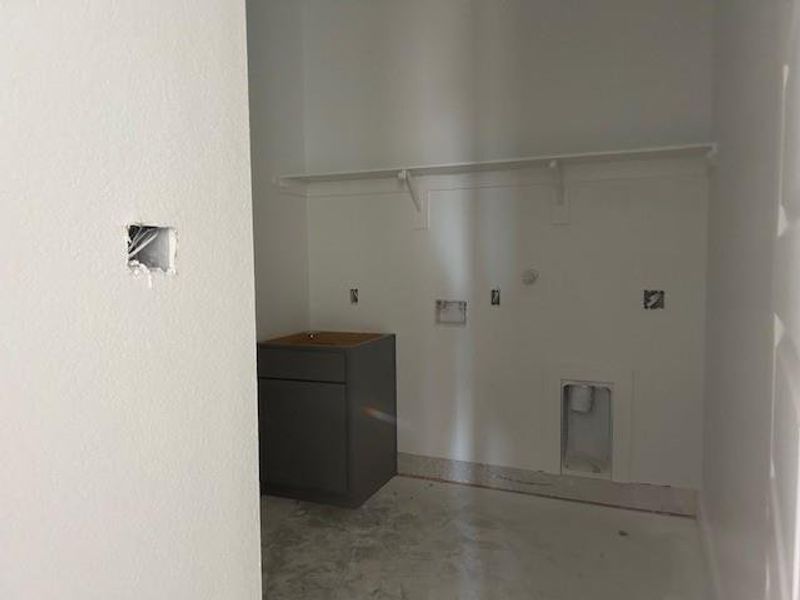 Large laundry room with a folding counter