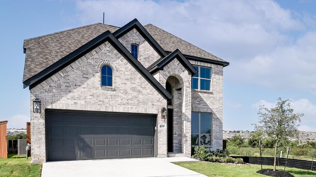 Front exterior of a new home in Homestead, Schertz, TX, highlighting curb appeal (Image 22).