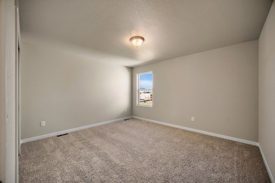 Spacious, unfurnished interior of a new home in Ridge at Lorson Ranch, Colorado Springs (Image 36).