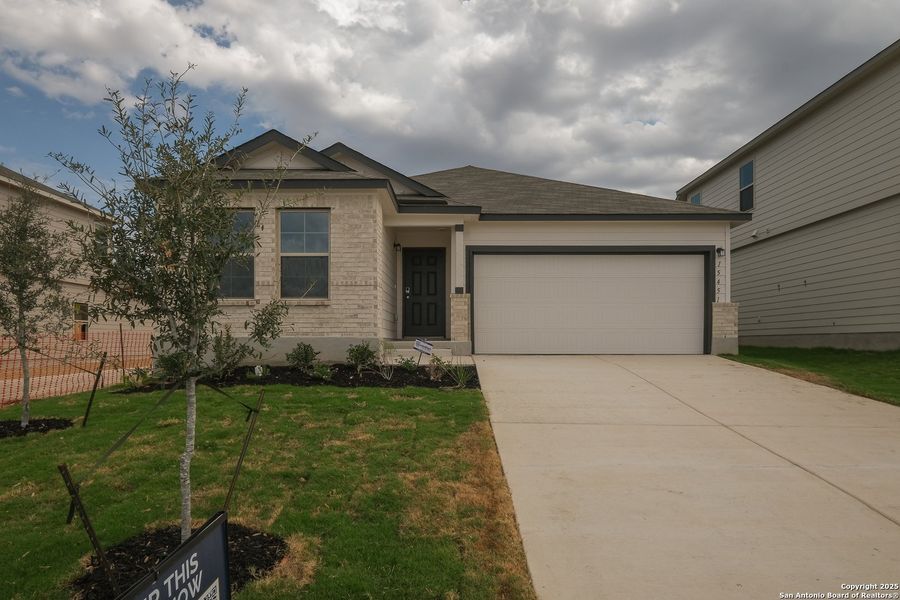 Front exterior of a new home in Hunters Ranch, San Antonio, TX, highlighting curb appeal (Image 17). Front exterior of a new home in Hunters Ranch, San Antonio, TX, highlighting curb appeal (Image 17).