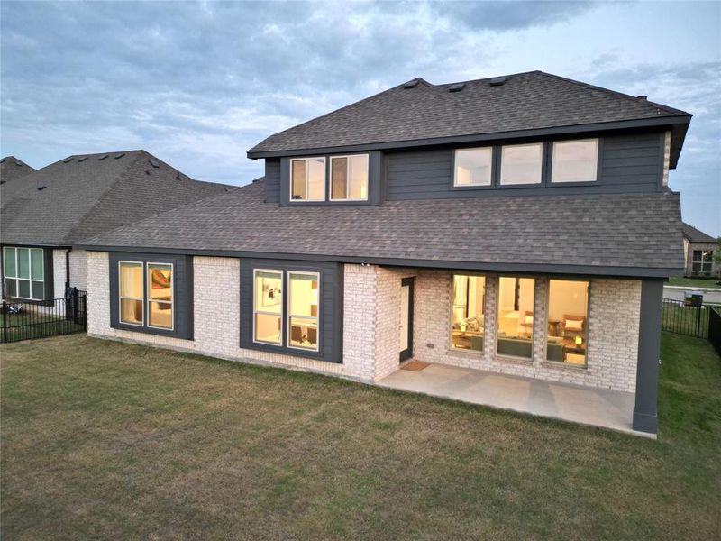 Exterior details and patio area of a home in Abe's Landing, Granbury (Image 3).