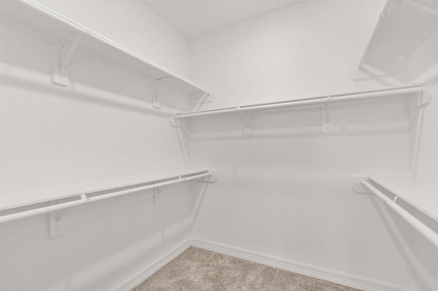 A view of your large primary walk-in Closet