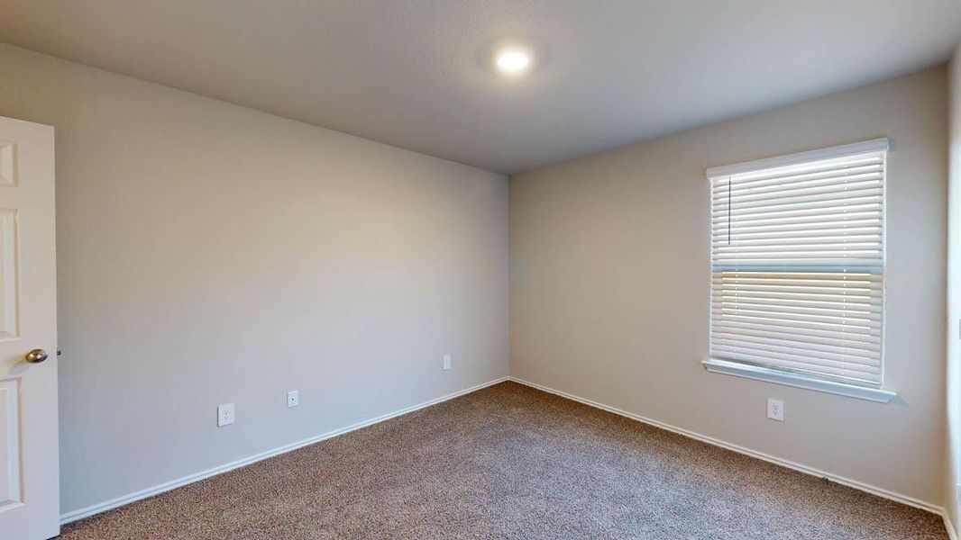 Empty room with carpet floors