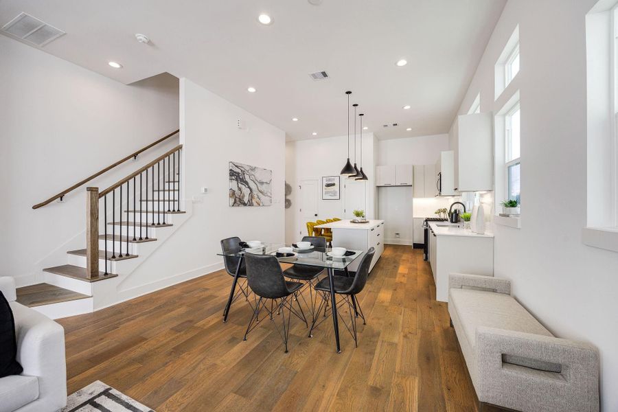 Elegant dining area seamlessly connected to a modern kitchen, perfect for entertaining and family gatherings.