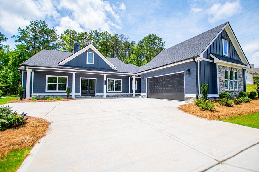 Front exterior of a new home in WOODMONT RESERVE, Roopville, GA, highlighting curb appeal (Image 38).