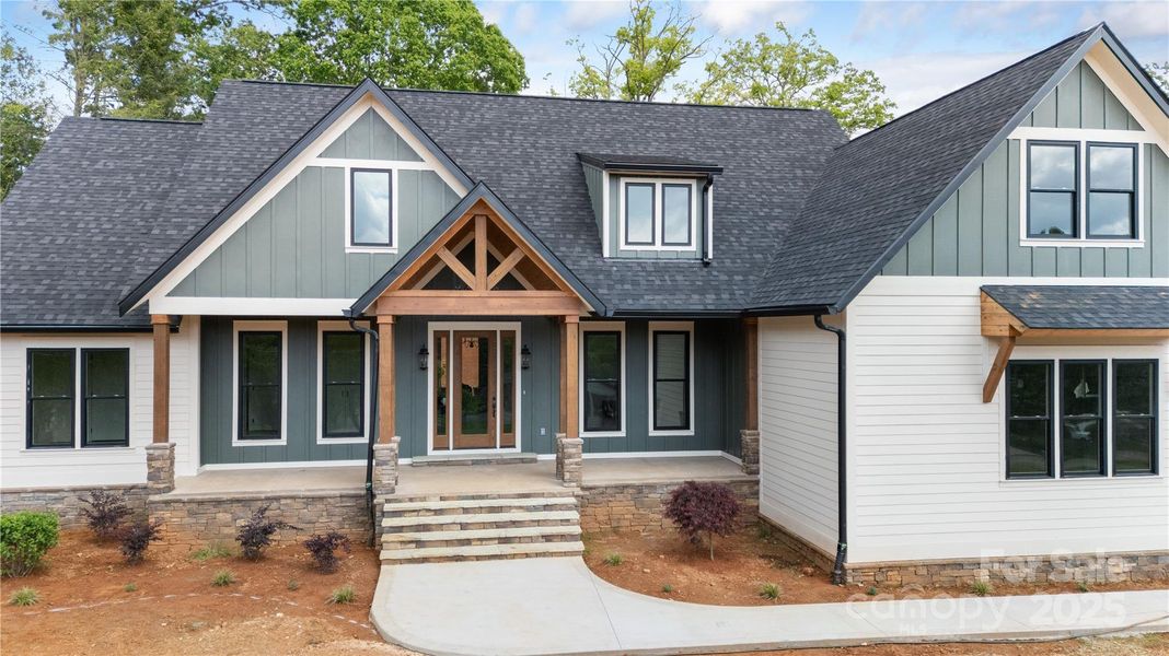 Front exterior of a new home in , Hendersonville, NC, highlighting curb appeal (Image 24). Front exterior of a new home in , Hendersonville, NC, highlighting curb appeal (Image 24).