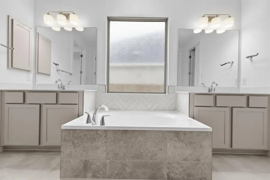 Primary Bath retreat with dual vanities & garden tub