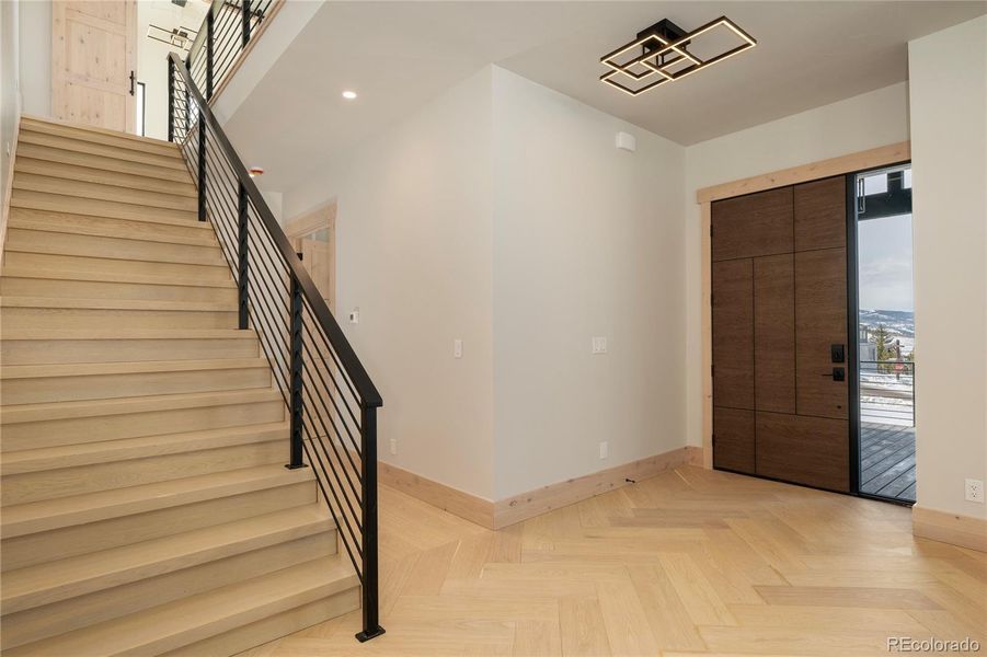 Custom iron handrail and 42" front door