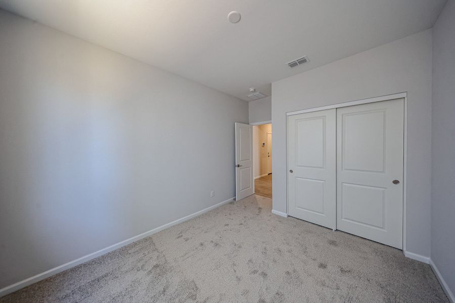 A hallway with white doors. A hallway with white doors.
