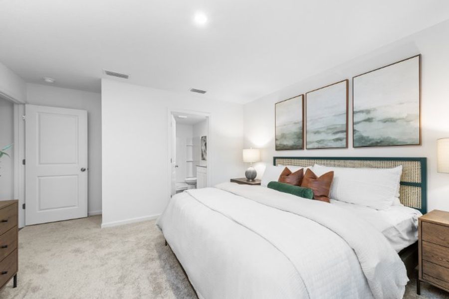 A bedroom with a bed and a couch. A bedroom with a bed and a couch.