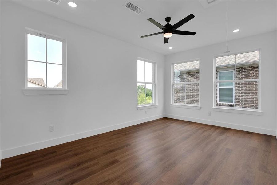 Unfurnished room with dark wood-style floors, recessed lighting, and ceiling fan Unfurnished room with dark wood-style floors, recessed lighting, and ceiling fan