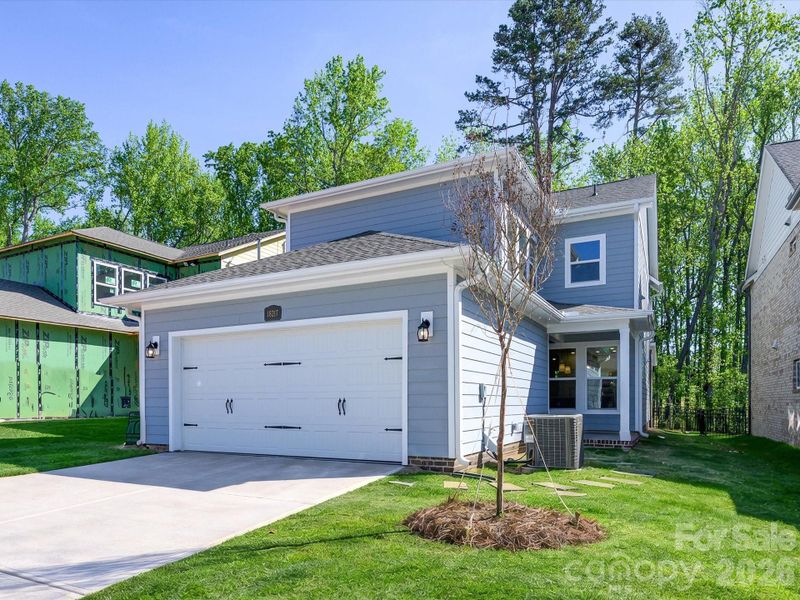 Front exterior of a new home in Whitley Preserve – Park Collection, Mint Hill, NC, highlighting curb appeal (Image 2). Front exterior of a new home in Whitley Preserve – Park Collection, Mint Hill, NC, highlighting curb appeal (Image 2).
