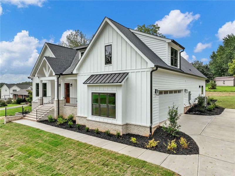 Front exterior of a new home in , Cumming, GA, highlighting curb appeal (Image 31). Front exterior of a new home in , Cumming, GA, highlighting curb appeal (Image 31).