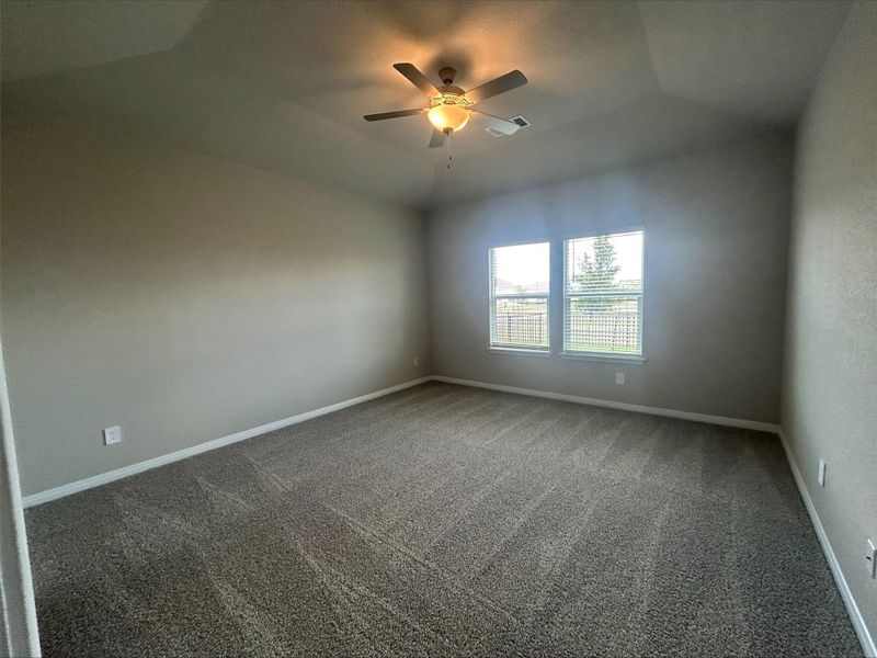 Spare room with ceiling fan and carpet floors Spare room with ceiling fan and carpet floors