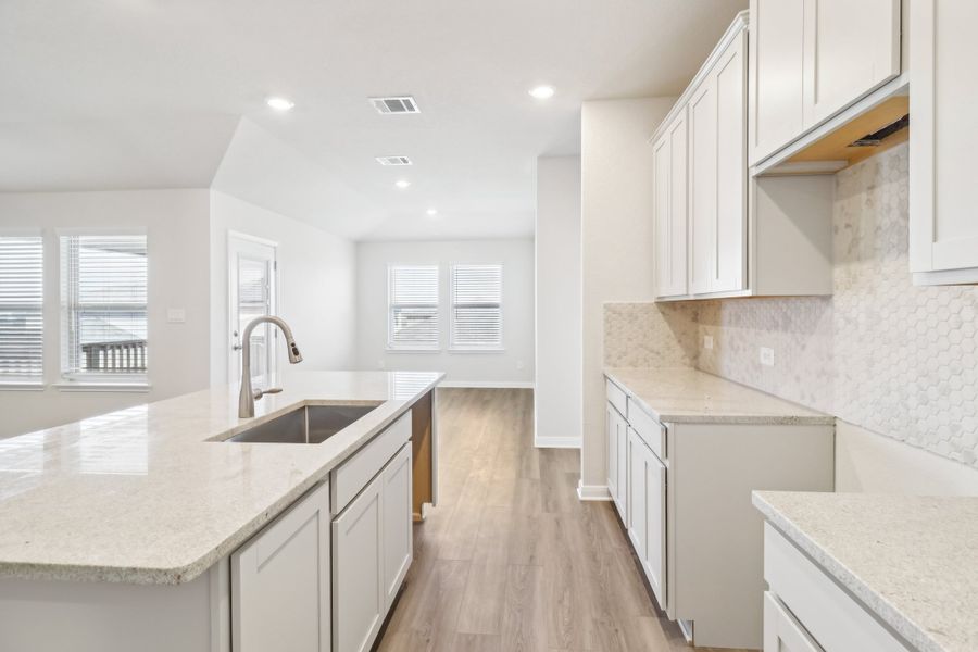 Kitchen in the Briscoe floorplan at a Meritage Homes community.