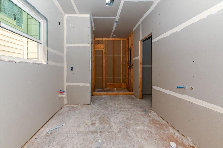 Primary bathroom with double sinks, standalone shower and soaking tub