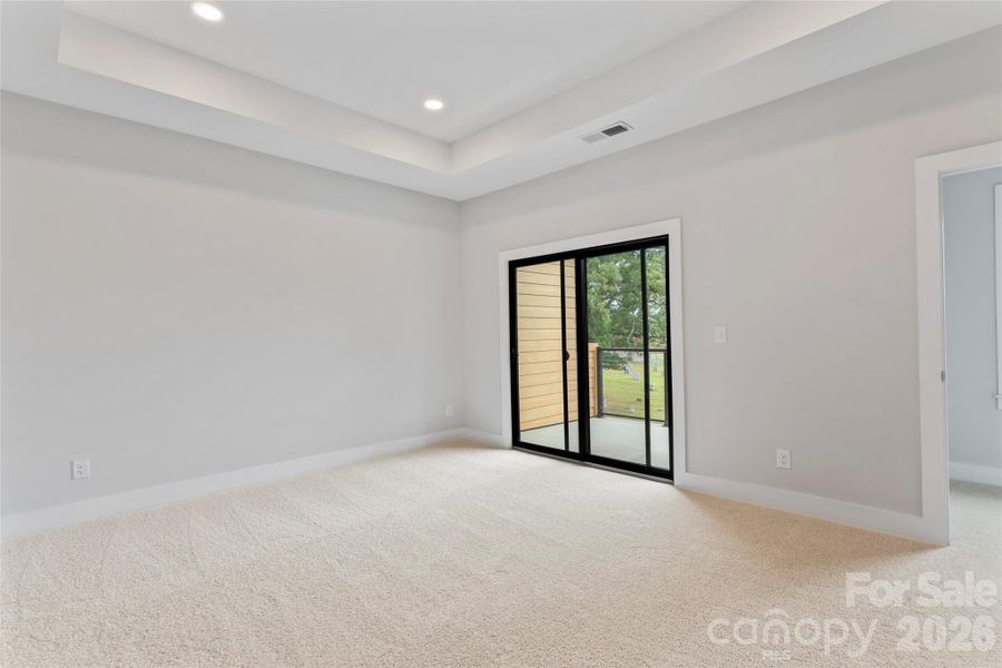 Primary suite features sliding glass doors to a private balcony retreat. Primary suite features sliding glass doors to a private balcony retreat.