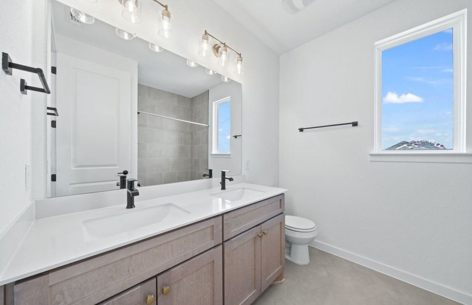 Furnished interior view inside a new home in 6 Creeks, Kyle (Image 11).