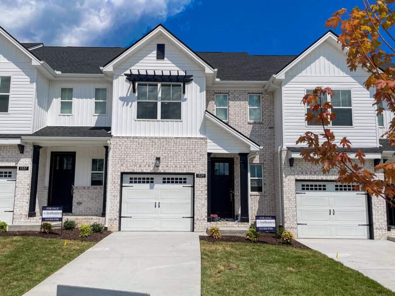 Front exterior of a new home in The Grove at Kennesaw Farms, Gallatin, TN, highlighting curb appeal (Image 1). Front exterior of a new home in The Grove at Kennesaw Farms, Gallatin, TN, highlighting curb appeal (Image 1).