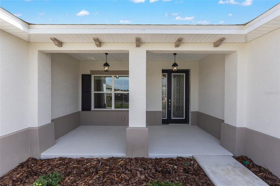 Exterior details and patio area of a home in On Top of the World Communities, Ocala (Image 3).