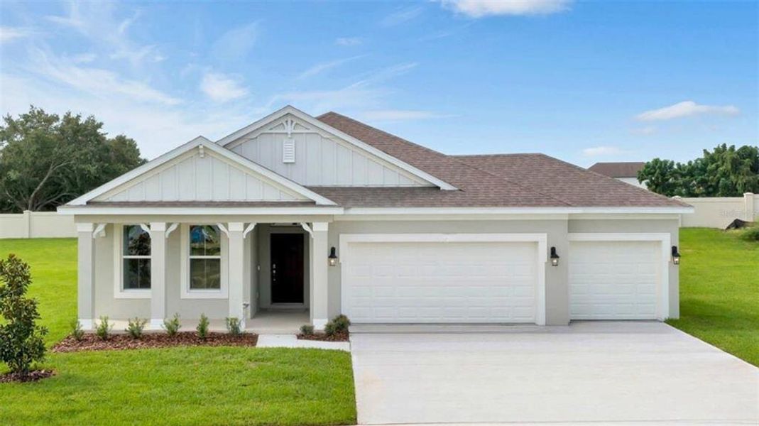 Front exterior of a new home in Kindred, Kissimmee, FL, highlighting curb appeal (Image 1).