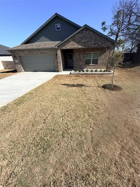 Front exterior of a new home in , Bowie, TX, highlighting curb appeal (Image 17). Front exterior of a new home in , Bowie, TX, highlighting curb appeal (Image 17).